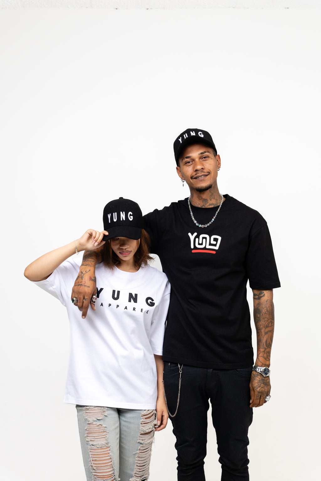 Two people wearing black and white t-shirts with 'YUNG' branding on a white background
Streetwear South Africa