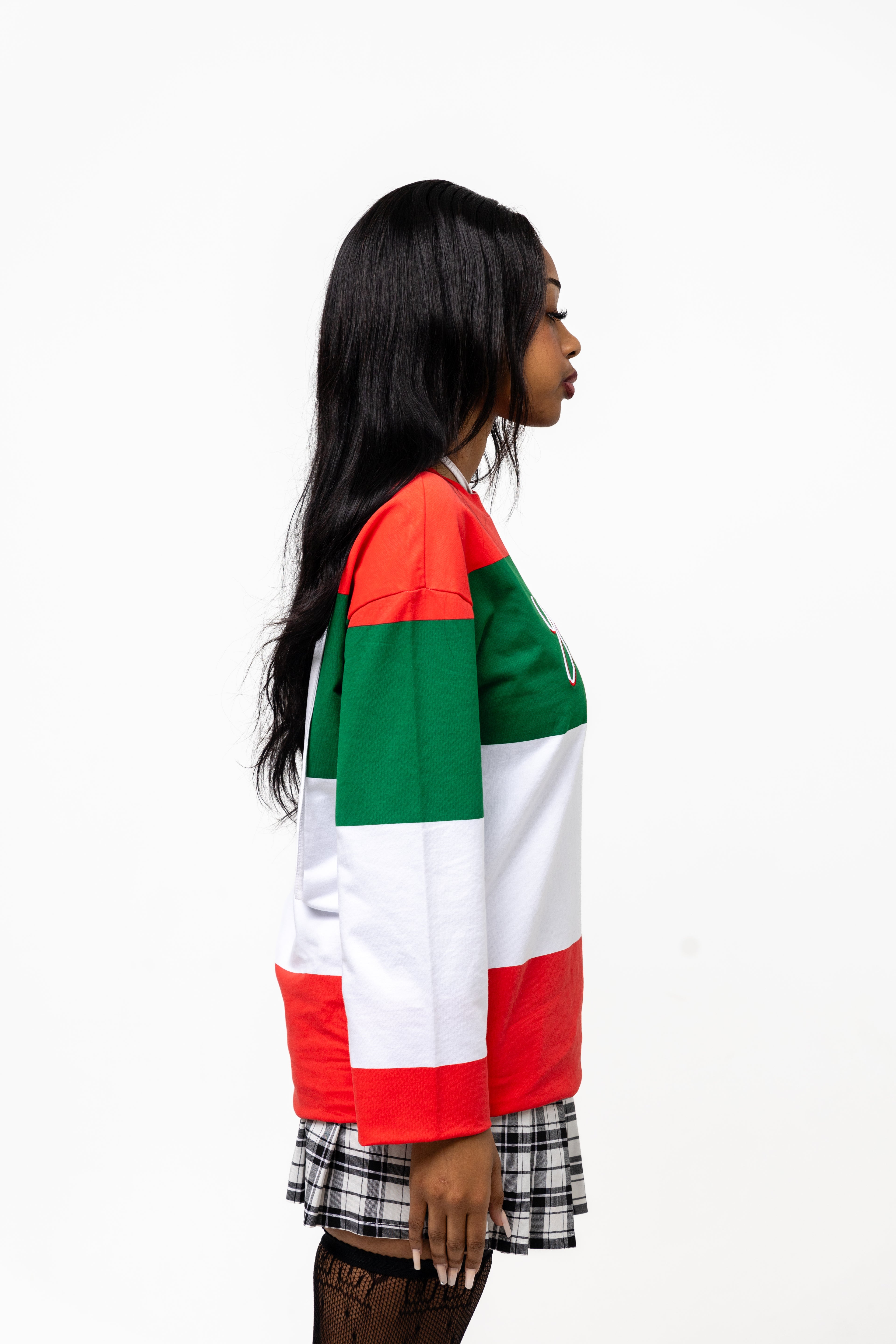 Person wearing a multicolored jacket with red, green, and white on a white background
Streetwear South Africa