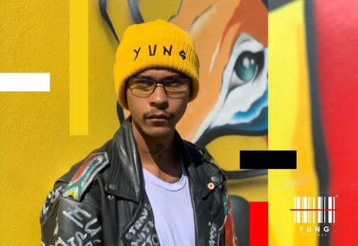 Person wearing a yellow beanie with 'YUNG' text, standing in front of colorful graffiti art.
Streetwear South Africa