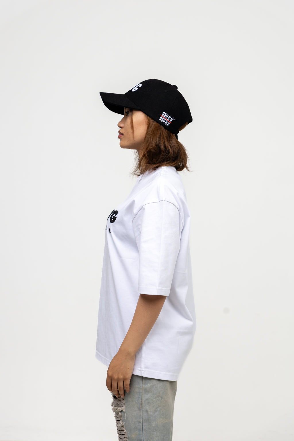 Person wearing a black cap and white t-shirt on a white background
Streetwear South Africa