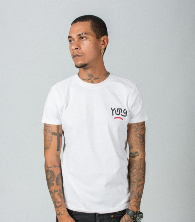 Man wearing a YUNG white t-shirt with a logo in front on a plain background
Streetwear South Africa