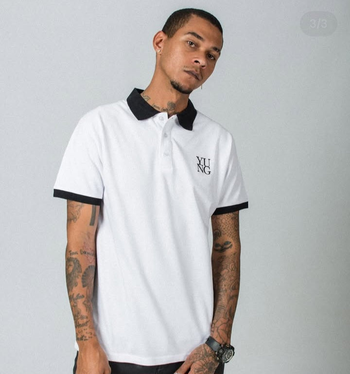 Man wearing a YUNG elegance white golf shirt with black accents 
Streetwear South Africa