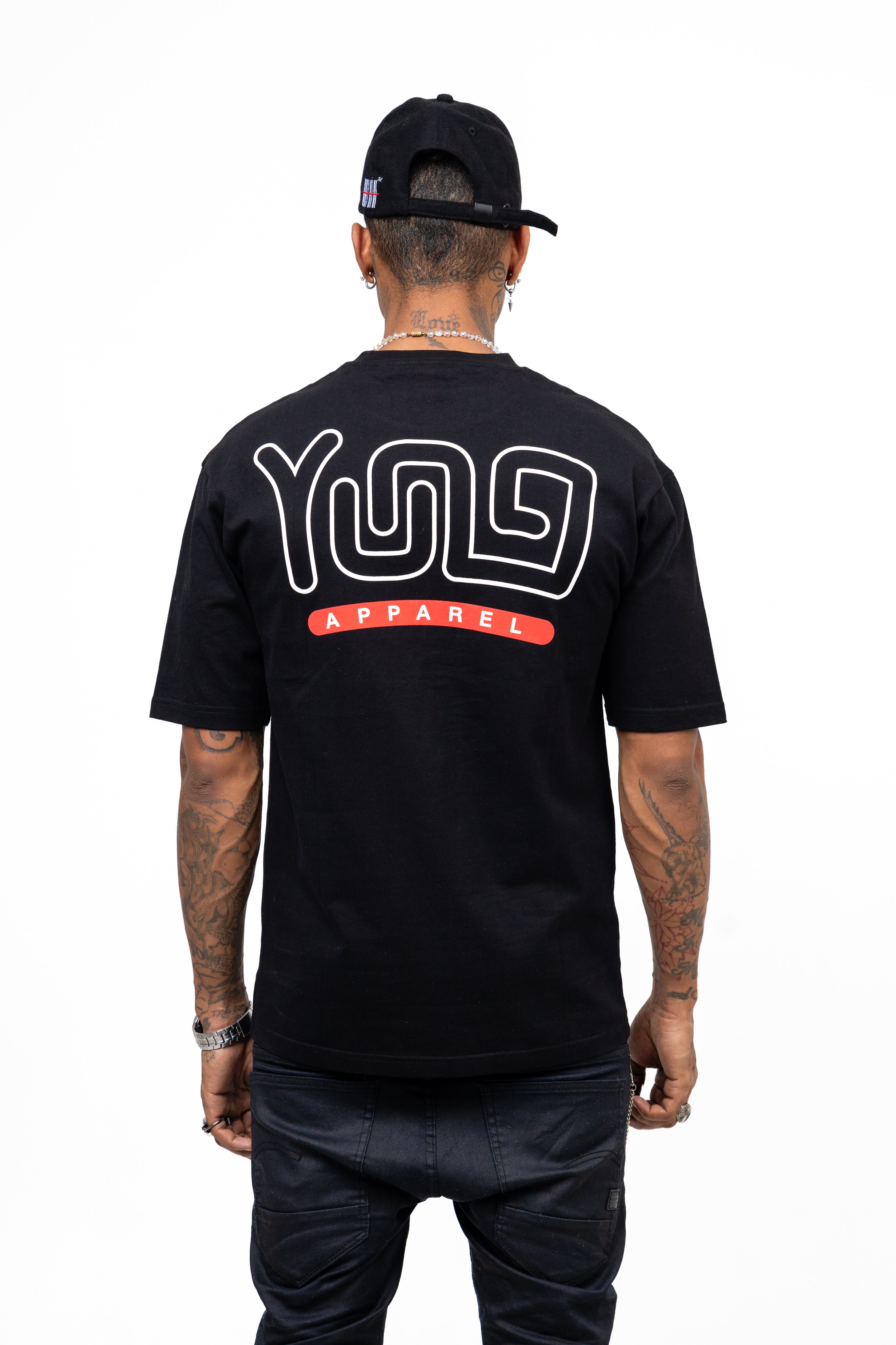 Person wearing a black t-shirt with 'YUG Apparel' logo on the back, standing against a white background.
Streetwear South Africa