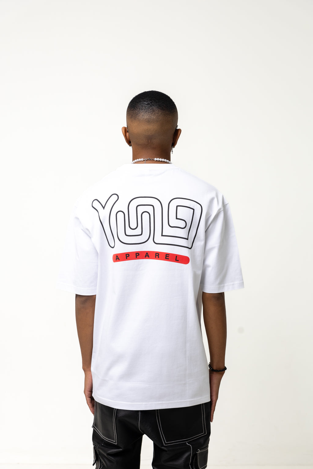 Person wearing a white t-shirt with a logo on the back against a white background
Streetwear South Africa