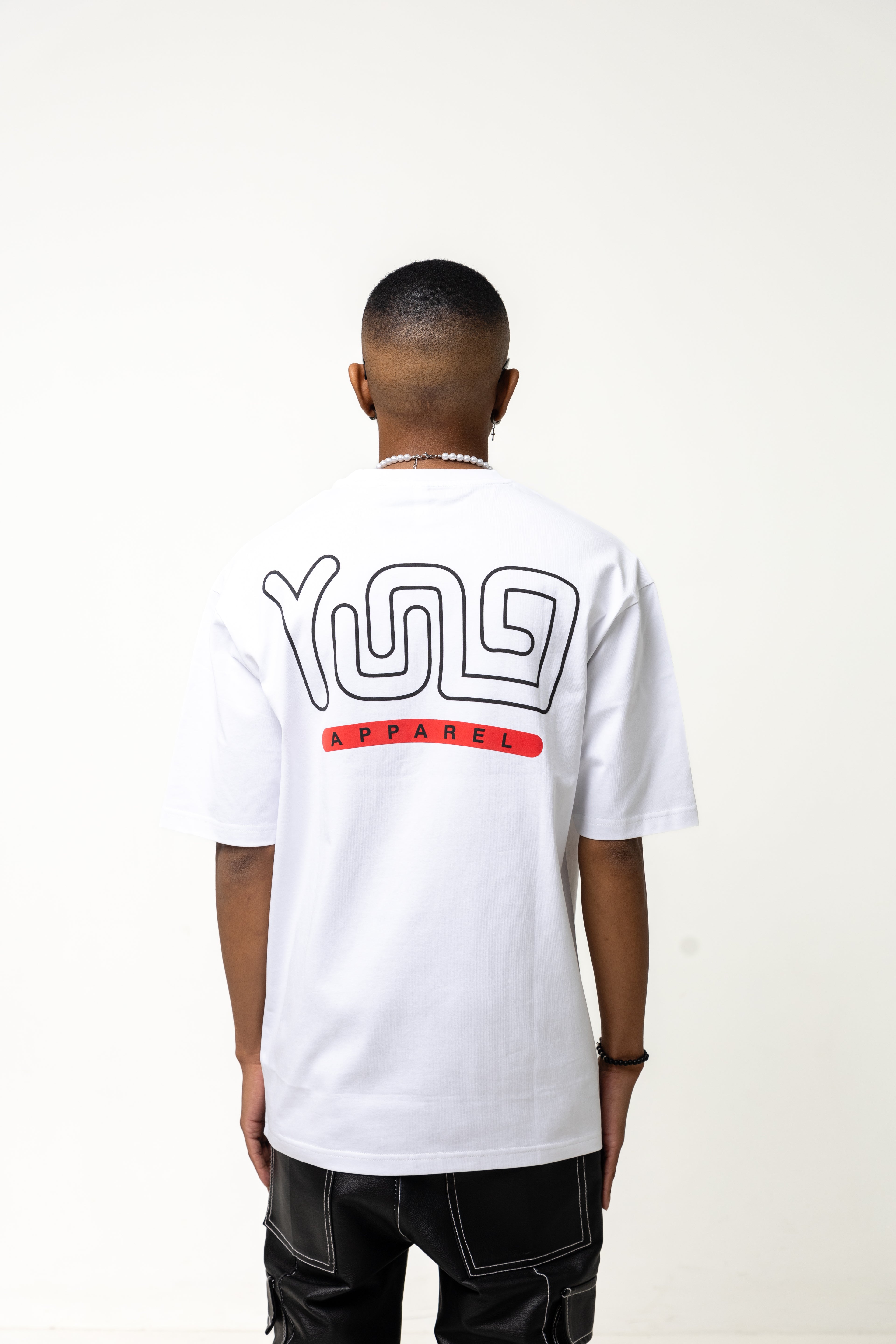 Person wearing a white t-shirt with a logo on the back against a white background
Streetwear South Africa