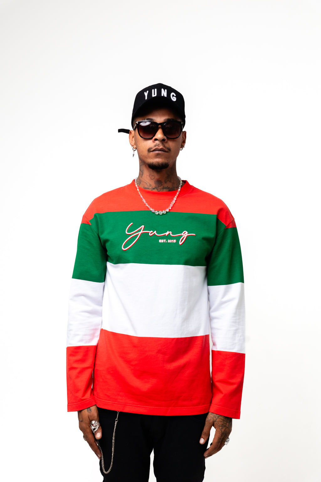 Person wearing a red, green, and white striped shirt with 'Yung' text on a white background
Streetwear South Africa